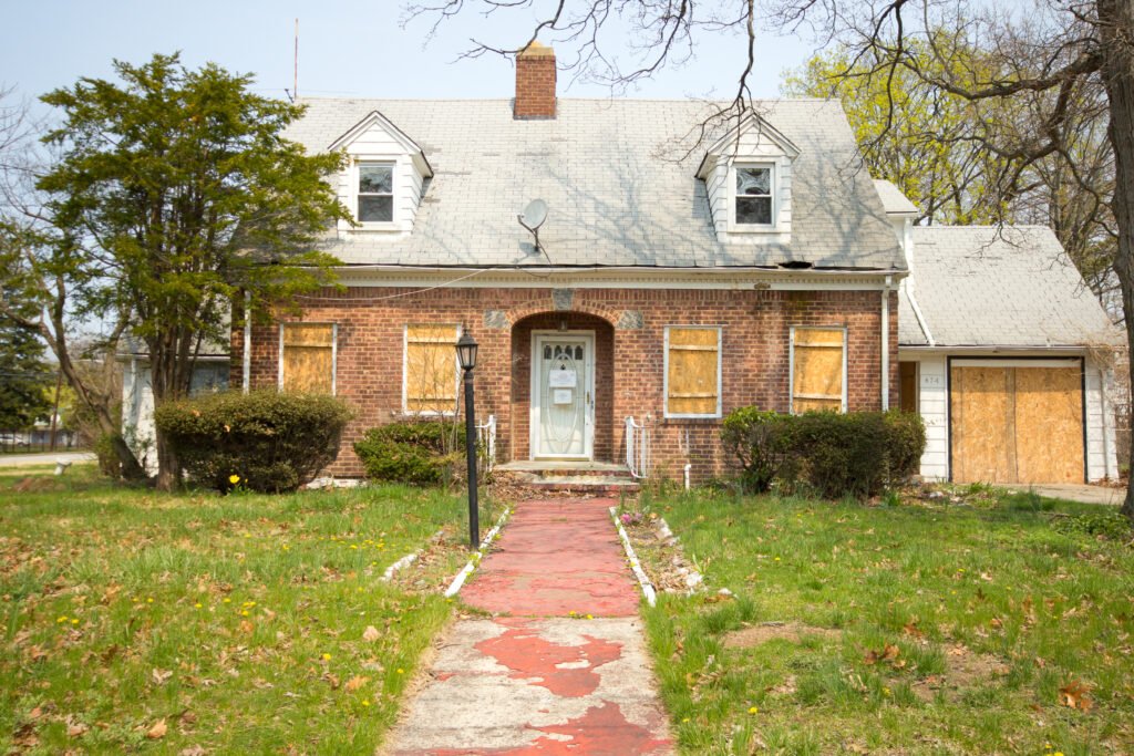 abandoned home boarded windows